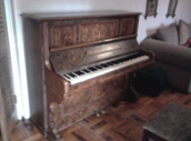 A typical overdamper upright piano from the early 20th century
